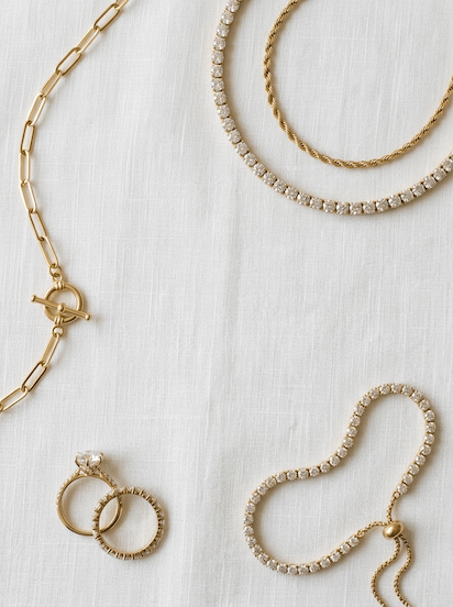 Fine jewelry suite arranged on linen and silk