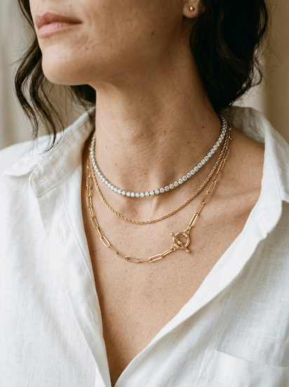Layered fine gold and diamond necklaces